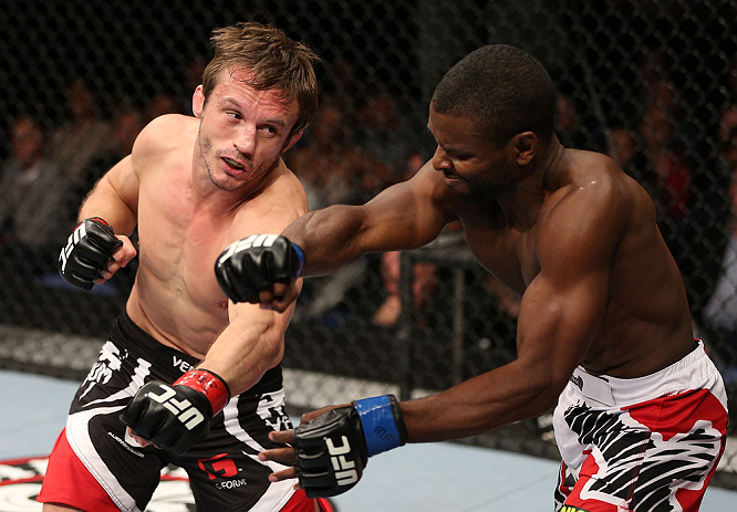 NOTTINGHAM, ENGLAND - SEPTEMBER 29: (L-R) Brad Pickett punches Yves Jabouin during their bantamweight fight at the UFC on Fuel TV event at Capital FM Arena on September 29, 2012 in Nottingham, England. (Photo by Josh Hedges/Zuffa LLC/Zuffa LLC via Getty Images)