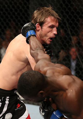NOTTINGHAM, ENGLAND - SEPTEMBER 29: (L-R) Brad Pickett punches Yves Jabouin during their bantamweight fight at the UFC on Fuel TV event at Capital FM Arena on September 29, 2012 in Nottingham, England. (Photo by Josh Hedges/Zuffa LLC/Zuffa LLC via Getty Images)