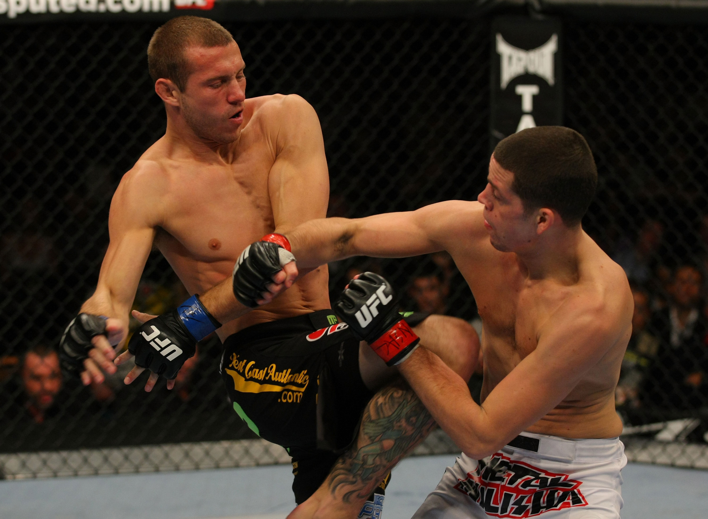 LAS VEGAS, NV - DECEMBER 30: Donald Cerrone (left) and Nate Diaz (right) exchange blows during the UFC 141 event at the MGM Grand Garden Arena on December 30, 2011 in Las Vegas, Nevada. (Photo by Donald Miralle/Zuffa LLC/Zuffa LLC via Getty Images) *** Local Caption *** Donald Cerrone; Nate Diaz