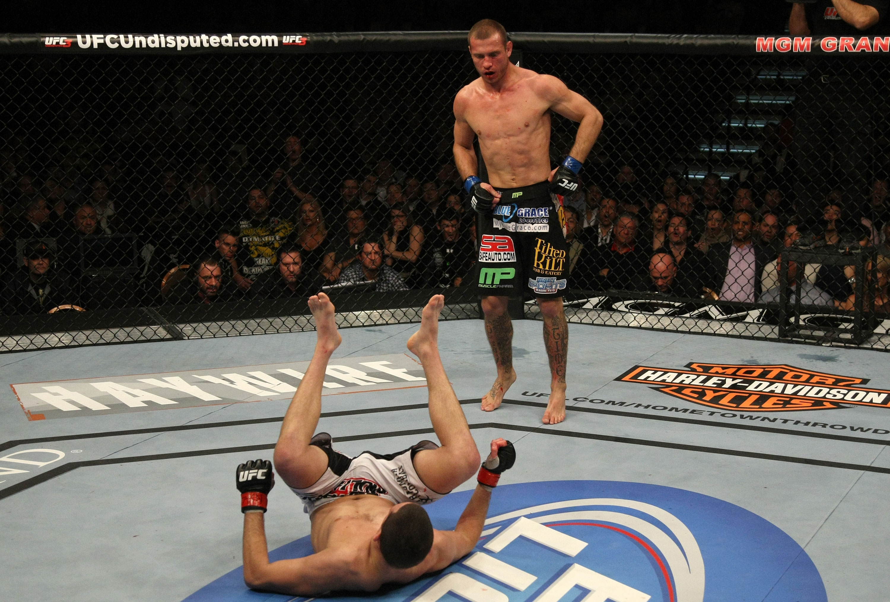 LAS VEGAS, NV - DECEMBER 30: Donald Cerrone (top) stands over Nate Diaz after a knockdown during the UFC 141 event at the MGM Grand Garden Arena on December 30, 2011 in Las Vegas, Nevada. (Photo by Donald Miralle/Zuffa LLC/Zuffa LLC via Getty Images) *** Local Caption *** Donald Cerrone; Nate Diaz