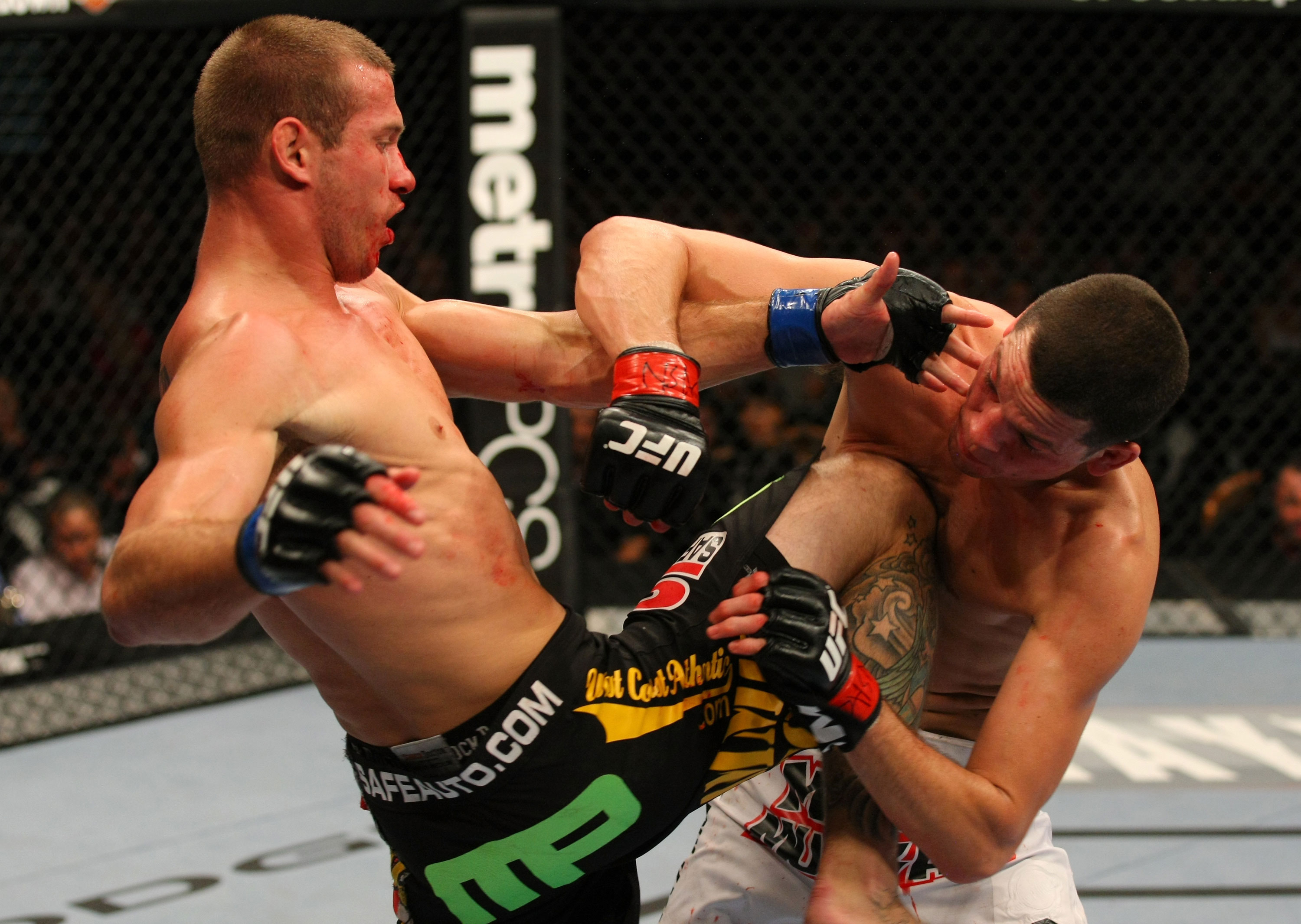 LAS VEGAS, NV - DECEMBER 30: Donald Cerrone (left) hits Nate Diaz with a knee strike during the UFC 141 event at the MGM Grand Garden Arena on December 30, 2011 in Las Vegas, Nevada. (Photo by Donald Miralle/Zuffa LLC/Zuffa LLC via Getty Images) *** Local Caption *** Donald Cerrone; Nate Diaz