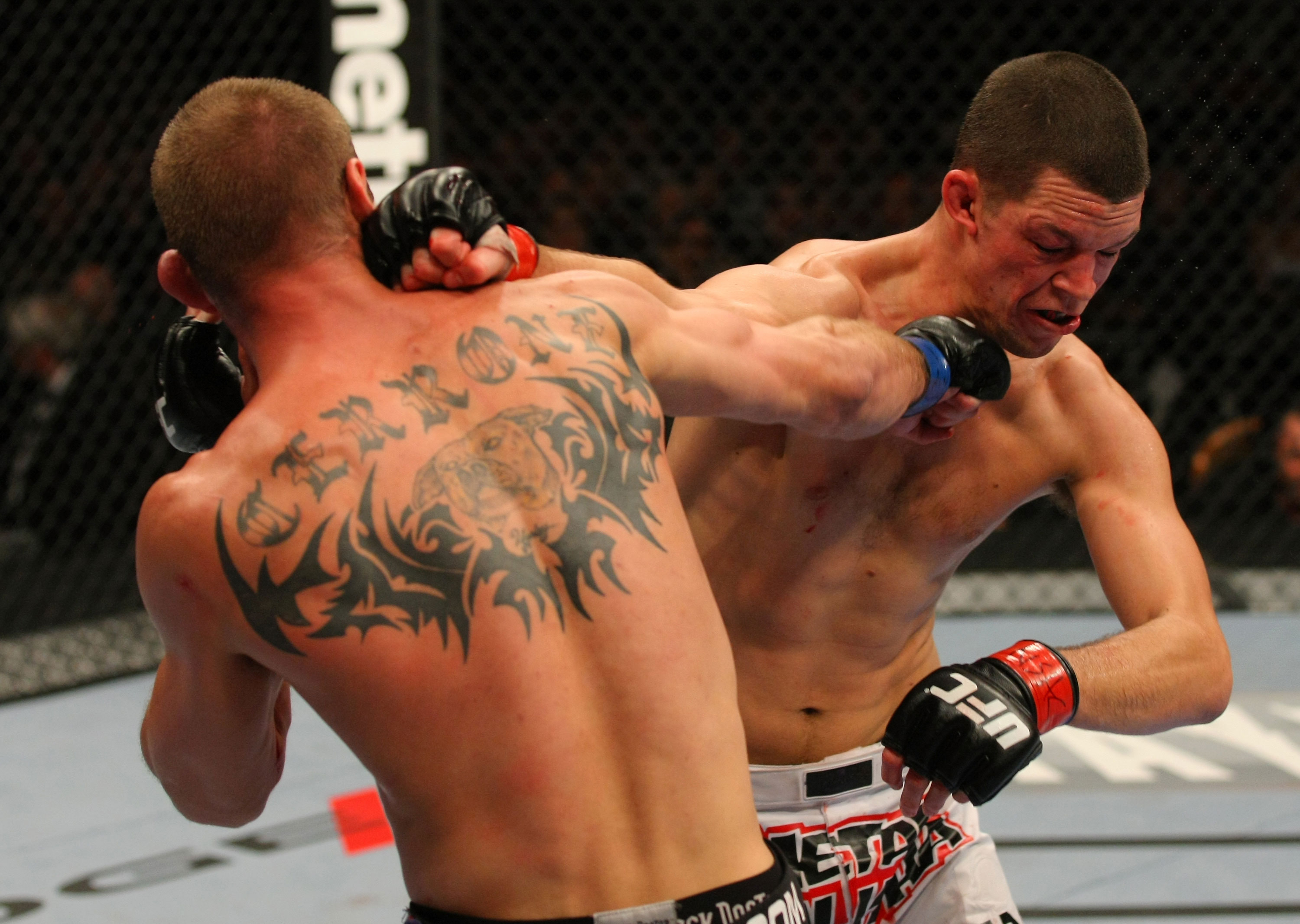 LAS VEGAS, NV - DECEMBER 30: Donald Cerrone (left) and Nate Diaz (right) exchange blows during the UFC 141 event at the MGM Grand Garden Arena on December 30, 2011 in Las Vegas, Nevada. (Photo by Donald Miralle/Zuffa LLC/Zuffa LLC via Getty Images) *** Local Caption *** Donald Cerrone; Nate Diaz