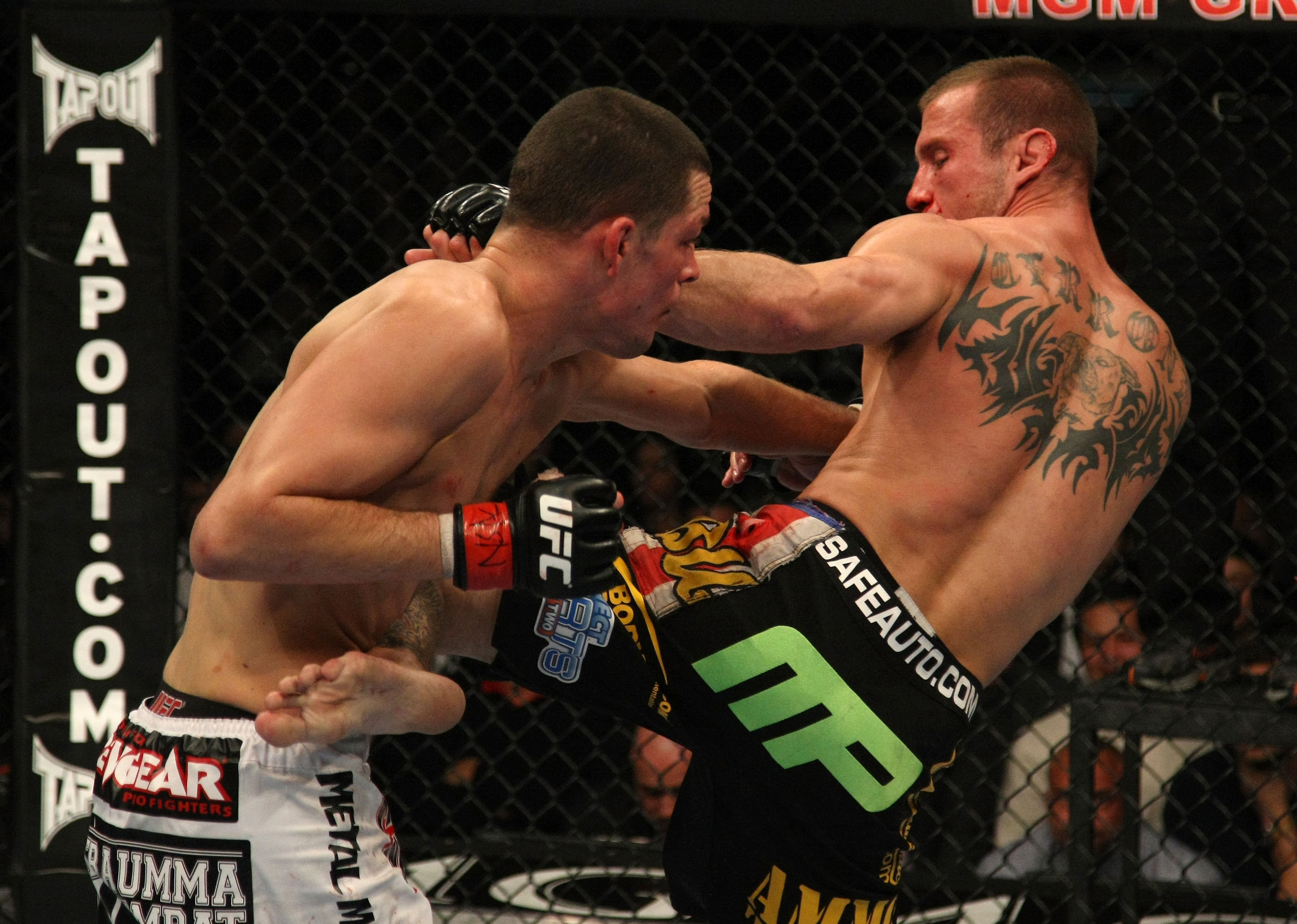 LAS VEGAS, NV - DECEMBER 30: Donald Cerrone (right) and Nate Diaz (left) exchange blows during the UFC 141 event at the MGM Grand Garden Arena on December 30, 2011 in Las Vegas, Nevada. (Photo by Donald Miralle/Zuffa LLC/Zuffa LLC via Getty Images) *** Local Caption *** Donald Cerrone; Nate Diaz