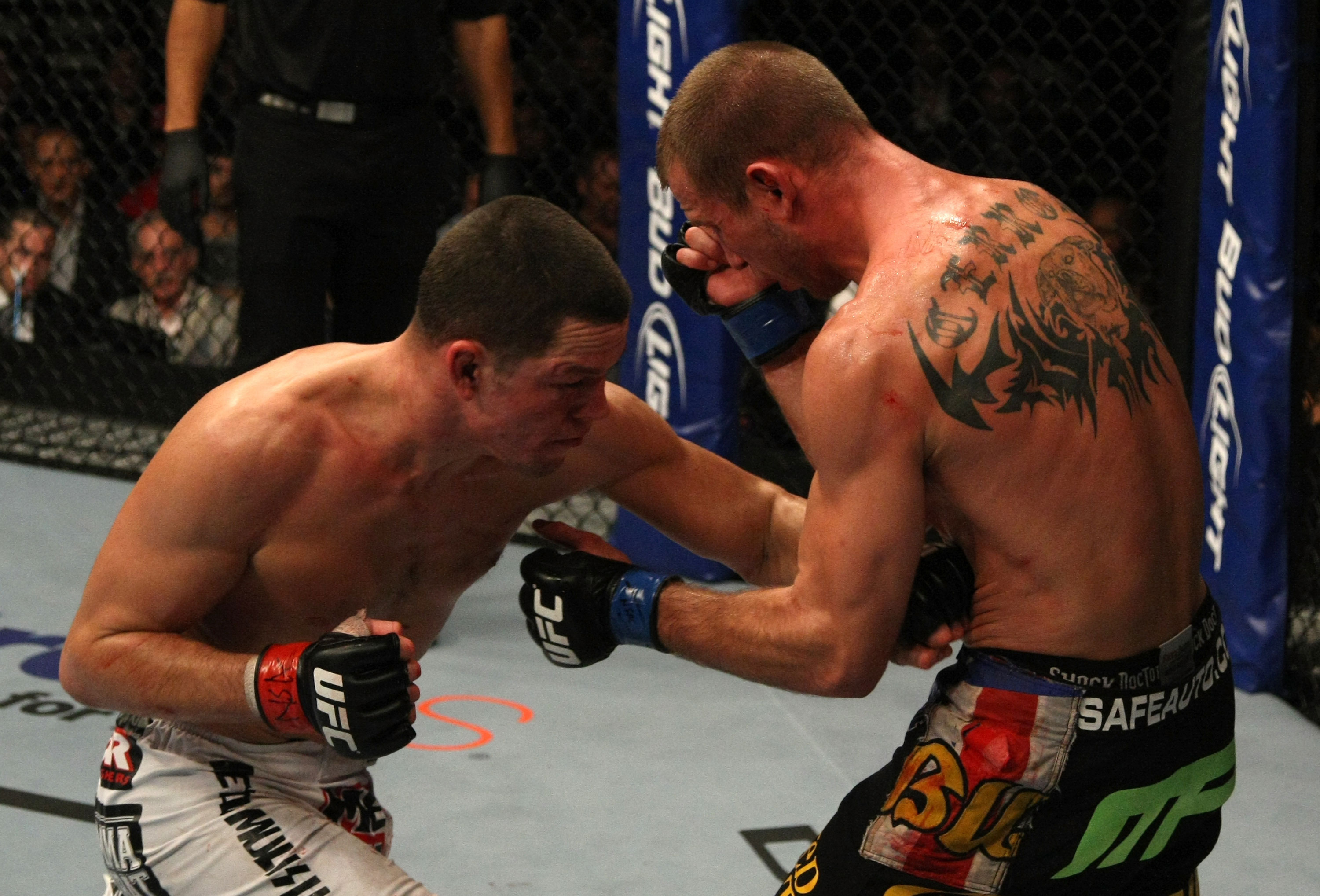 LAS VEGAS, NV - DECEMBER 30: Nate Diaz (left) hits Donald Cerrone with a punch to the body during the UFC 141 event at the MGM Grand Garden Arena on December 30, 2011 in Las Vegas, Nevada. (Photo by Donald Miralle/Zuffa LLC/Zuffa LLC via Getty Images) *** Local Caption *** Nate Diaz; Donald Cerrone