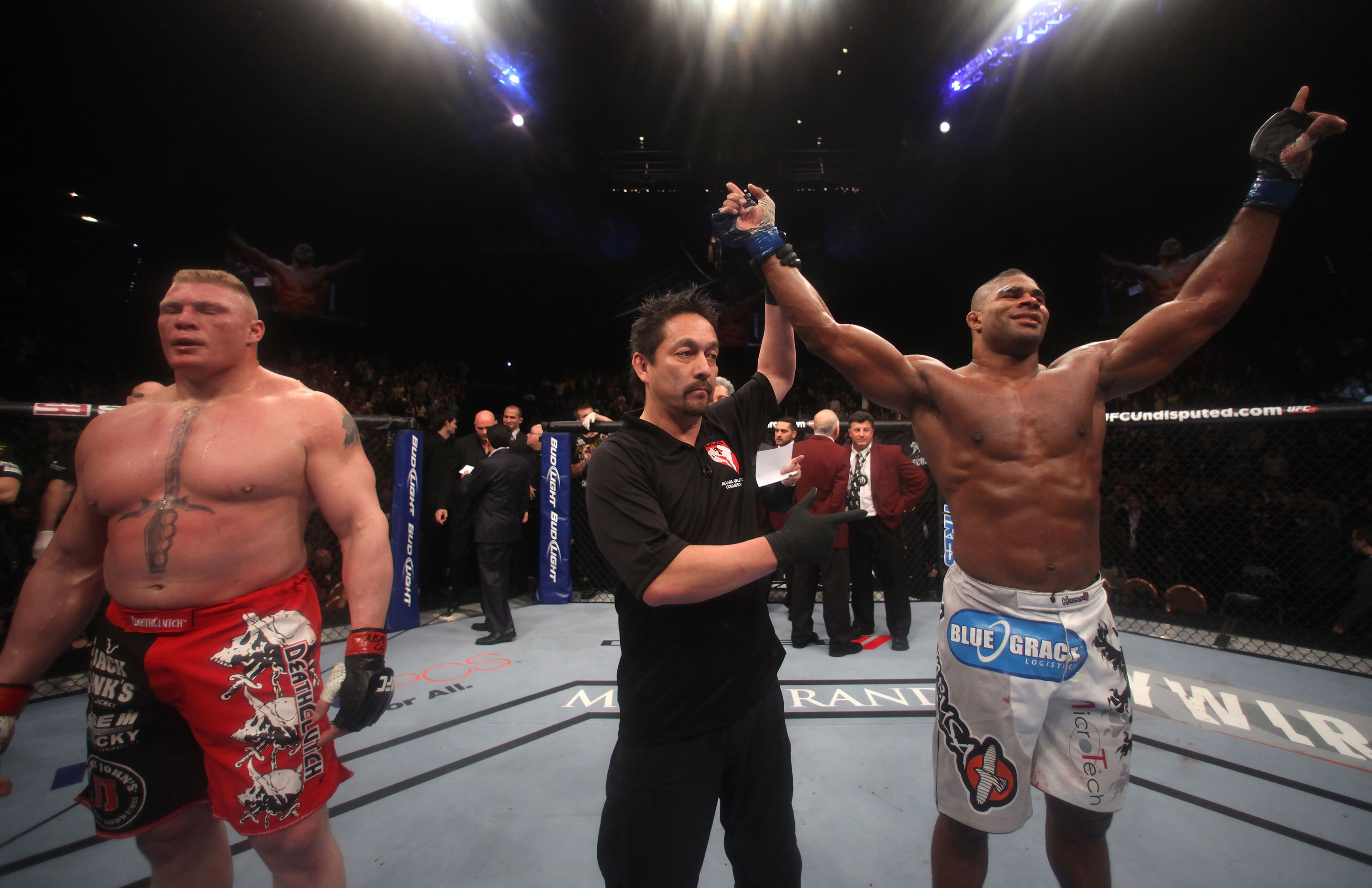 LAS VEGAS, NV - DECEMBER 30: Alistair Overeem (right) is declared the winner in his fight over Brock Lesnar (left) during the UFC 141 event at the MGM Grand Garden Arena on December 30, 2011 in Las Vegas, Nevada. (Photo by Donald Miralle/Zuffa LLC/Zuffa LLC via Getty Images) *** Local Caption *** Alistair Overeem; Brock Lesnar
