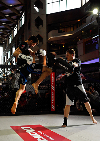 MONTREAL, QC - MARCH 13: Carlos Condit (L) conducts an open training session for fans and media ahead of his UFC 158 bout at Complexe Desjardins on March 13, 2013 in Montreal, Quebec, Canada. (Photo by Josh Hedges/Zuffa LLC/Zuffa LLC via Getty Images)