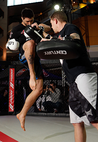 MONTREAL, QC - MARCH 13: Carlos Condit (L) conducts an open training session for fans and media ahead of his UFC 158 bout at Complexe Desjardins on March 13, 2013 in Montreal, Quebec, Canada. (Photo by Josh Hedges/Zuffa LLC/Zuffa LLC via Getty Images)