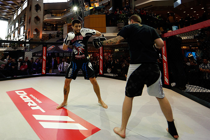 MONTREAL, QC - MARCH 13: Carlos Condit (L) conducts an open training session for fans and media ahead of his UFC 158 bout at Complexe Desjardins on March 13, 2013 in Montreal, Quebec, Canada. (Photo by Josh Hedges/Zuffa LLC/Zuffa LLC via Getty Images)