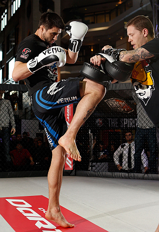MONTREAL, QC - MARCH 13: Carlos Condit (L) conducts an open training session for fans and media ahead of his UFC 158 bout at Complexe Desjardins on March 13, 2013 in Montreal, Quebec, Canada. (Photo by Josh Hedges/Zuffa LLC/Zuffa LLC via Getty Images)