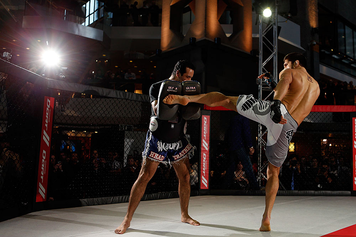MONTREAL, QC - MARCH 13: Patrick Cote (R) conducts an open training session for fans and media ahead of his UFC 158 bout at Complexe Desjardins on March 13, 2013 in Montreal, Quebec, Canada. (Photo by Josh Hedges/Zuffa LLC/Zuffa LLC via Getty Images)