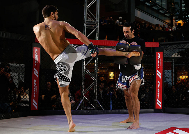 MONTREAL, QC - MARCH 13: Patrick Cote (L) conducts an open training session for fans and media ahead of his UFC 158 bout at Complexe Desjardins on March 13, 2013 in Montreal, Quebec, Canada. (Photo by Josh Hedges/Zuffa LLC/Zuffa LLC via Getty Images)