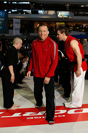 MONTREAL, QC - MARCH 13: UFC welterweight champion Georges St-Pierre is greeted by local students from the Sunfuki Karate school as he enters the Octaogn during the UFC 158 open workouts at Complexe Desjardins on March 13, 2013 in Montreal, Quebec, Canada. (Photo by Josh Hedges/Zuffa LLC/Zuffa LLC via Getty Images)