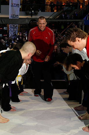 MONTREAL, QC - MARCH 13: UFC welterweight champion Georges St-Pierre is greeted by local students from the Sunfuki Karate school as he enters the Octaogn during the UFC 158 open workouts at Complexe Desjardins on March 13, 2013 in Montreal, Quebec, Canada. (Photo by Josh Hedges/Zuffa LLC/Zuffa LLC via Getty Images)