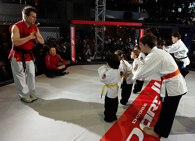 MONTREAL, QC - MARCH 13: UFC welterweight champion Georges St-Pierre (2L) watches a demonstration by students of the Sunfuki Karate school during the UFC 158 open workouts at Complexe Desjardins on March 13, 2013 in Montreal, Quebec, Canada. (Photo by Josh Hedges/Zuffa LLC/Zuffa LLC via Getty Images)