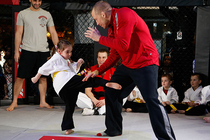 MONTREAL, QC - MARCH 13: UFC welterweight champion Georges St-Pierre (R) spars with students of the Sunfuki Karate school during the UFC 158 open workouts at Complexe Desjardins on March 13, 2013 in Montreal, Quebec, Canada. (Photo by Josh Hedges/Zuffa LLC/Zuffa LLC via Getty Images)