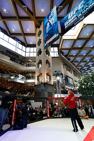 MONTREAL, QC - MARCH 13: UFC welterweight champion Georges St-Pierre tosses autographed DVD's into the crowd during the UFC 158 open workouts at Complexe Desjardins on March 13, 2013 in Montreal, Quebec, Canada. (Photo by Josh Hedges/Zuffa LLC/Zuffa LLC via Getty Images)