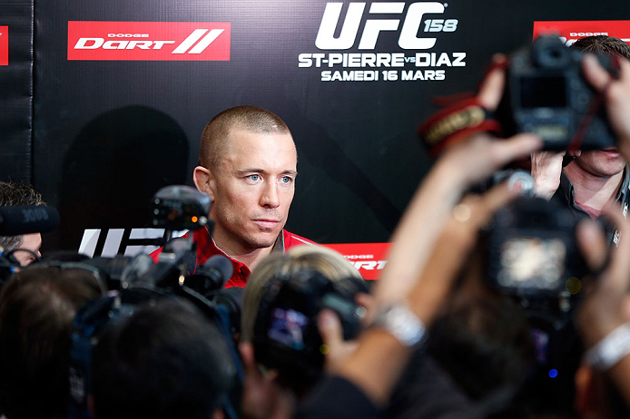 MONTREAL, QC - MARCH 13: UFC welterweight champion Georges St-Pierre interacts with media during the UFC 158 open workouts at Complexe Desjardins on March 13, 2013 in Montreal, Quebec, Canada. (Photo by Josh Hedges/Zuffa LLC/Zuffa LLC via Getty Images)
