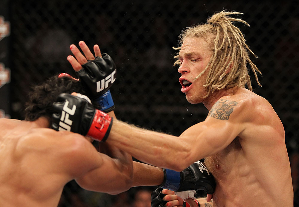 LAS VEGAS, NV - JUNE 01: (R-L) Jonathan Brookins punches Charles Oliveira in a Featherweight bout during The Ultimate Fighter Live Finale at the Pearl Theater at the Palms Casino Resort on June 1, 2012 in Las Vegas, Nevada. (Photo by Josh Hedges/Zuffa LLC/Zuffa LLC via Getty Images) *** Local Caption *** Jonathan Brookins; Charles Oliveira