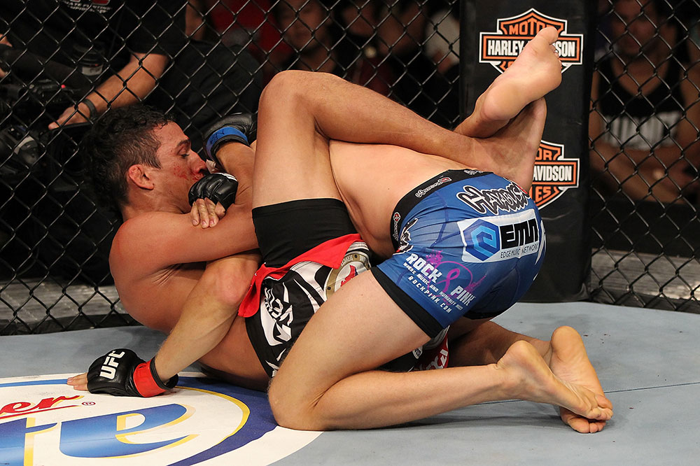 LAS VEGAS, NV - JUNE 01: Charles Oliveira (left) attempts to submit Jonathan Brookins in a Featherweight bout during The Ultimate Fighter Live Finale at the Pearl Theater at the Palms Casino Resort on June 1, 2012 in Las Vegas, Nevada. (Photo by Josh Hedges/Zuffa LLC/Zuffa LLC via Getty Images) *** Local Caption *** Jonathan Brookins; Charles Oliveira