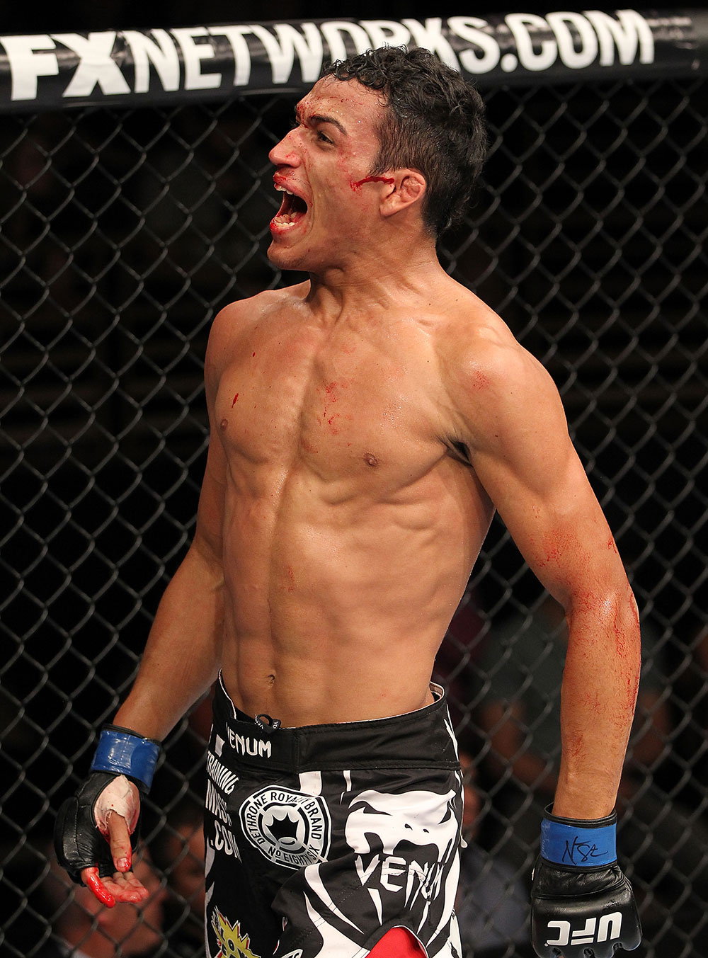 LAS VEGAS, NV - JUNE 01: Charles Oliveira reacts to his submission victory in a Featherweight bout during The Ultimate Fighter Live Finale at the Pearl Theater at the Palms Casino Resort on June 1, 2012 in Las Vegas, Nevada. (Photo by Josh Hedges/Zuffa LLC/Zuffa LLC via Getty Images) *** Local Caption *** Charles Oliveira