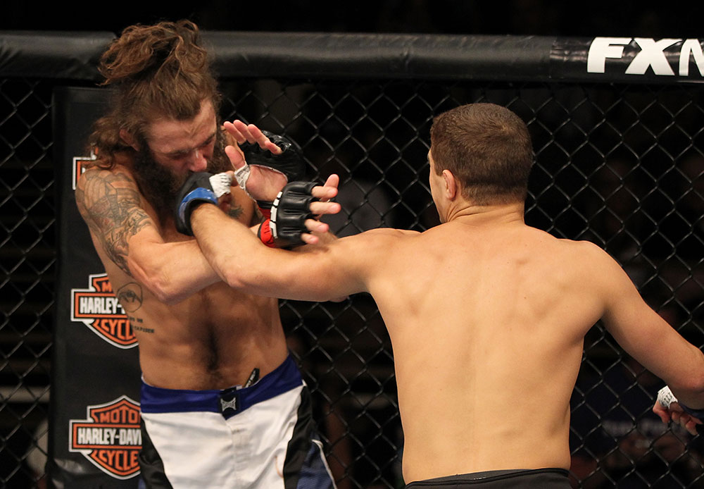 LAS VEGAS, NV - JUNE 01: (R-L) Al Iaquinta punches Michael Chiesa in a Lightweight bout during The Ultimate Fighter Live Finale at the Pearl Theater at the Palms Casino Resort on June 1, 2012 in Las Vegas, Nevada. (Photo by Josh Hedges/Zuffa LLC/Zuffa LLC via Getty Images) *** Local Caption *** Al Iaquinta; Michael Chiesa