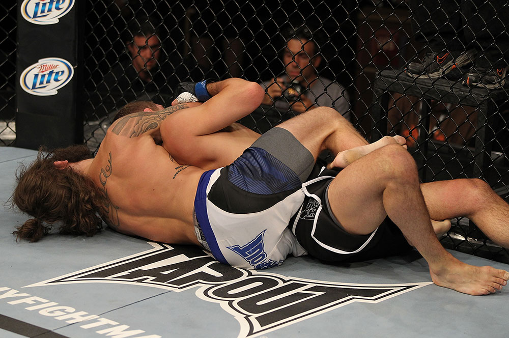 LAS VEGAS, NV - JUNE 01: (L-R) Michael Chiesa attempts to submit Al Iaquinta in a Lightweight bout during The Ultimate Fighter Live Finale at the Pearl Theater at the Palms Casino Resort on June 1, 2012 in Las Vegas, Nevada. (Photo by Josh Hedges/Zuffa LLC/Zuffa LLC via Getty Images) *** Local Caption *** Al Iaquinta; Michael Chiesa