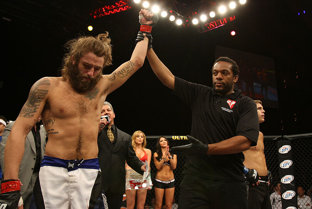 LAS VEGAS, NV - JUNE 01: Michael Chiesa (left) reacts to being declared the winner over Al Iaquinta (right) during The Ultimate Fighter Live Finale at the Pearl Theater at the Palms Casino Resort on June 1, 2012 in Las Vegas, Nevada. (Photo by Josh Hedges/Zuffa LLC/Zuffa LLC via Getty Images) *** Local Caption *** Al Iaquinta; Michael Chiesa