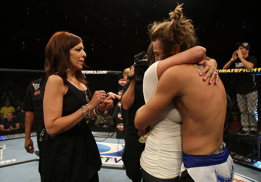 LAS VEGAS, NV - JUNE 01: Michael Chiesa (right) embraces his sister during The Ultimate Fighter Live Finale at the Pearl Theater at the Palms Casino Resort on June 1, 2012 in Las Vegas, Nevada. (Photo by Josh Hedges/Zuffa LLC/Zuffa LLC via Getty Images) *** Local Caption *** Michael Chiesa