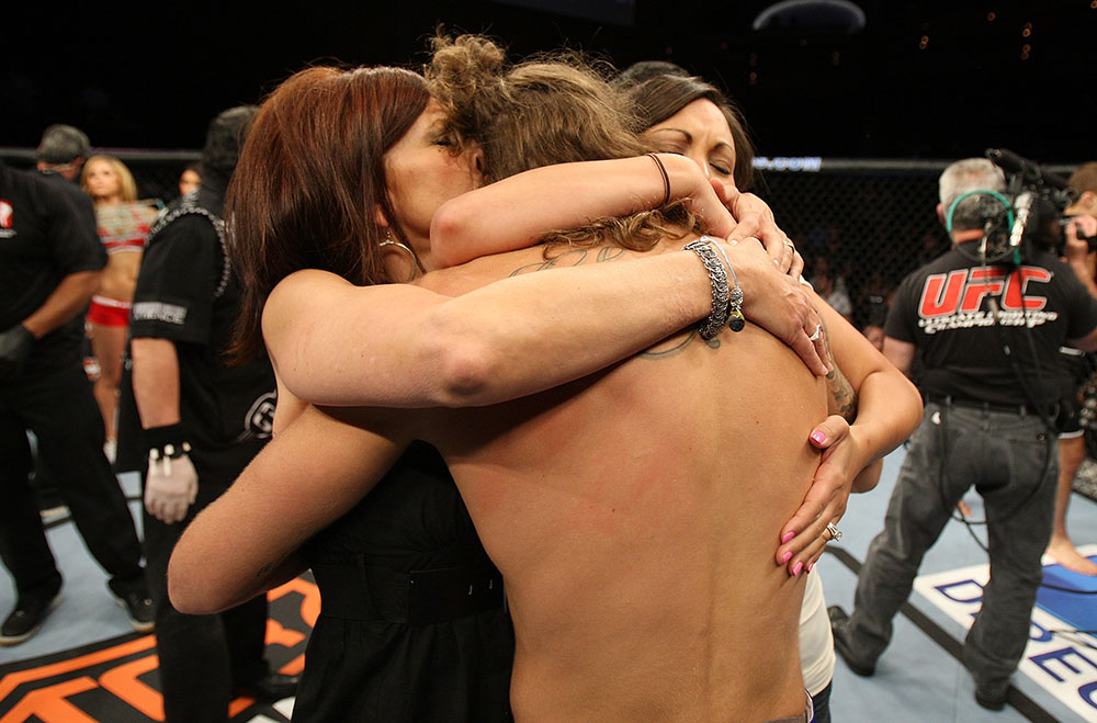 LAS VEGAS, NV - JUNE 01: Michael Chiesa (center) embraces his family during The Ultimate Fighter Live Finale at the Pearl Theater at the Palms Casino Resort on June 1, 2012 in Las Vegas, Nevada. (Photo by Josh Hedges/Zuffa LLC/Zuffa LLC via Getty Images) *** Local Caption *** Michael Chiesa