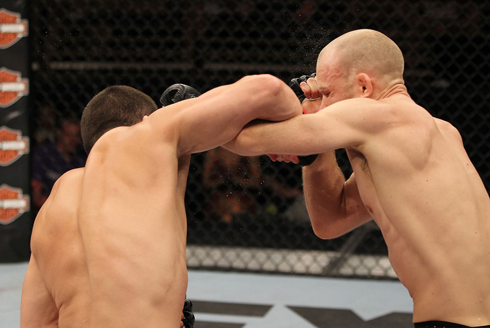 LAS VEGAS, NV - JUNE 01: (L-R) Jake Ellenberger punches Martin Kampmann in a Welterweight bout during The Ultimate Fighter Live Finale at the Pearl Theater at the Palms Casino Resort on June 1, 2012 in Las Vegas, Nevada. (Photo by Josh Hedges/Zuffa LLC/Zuffa LLC via Getty Images) *** Local Caption *** Jake Ellenberger; Martin Kampmann