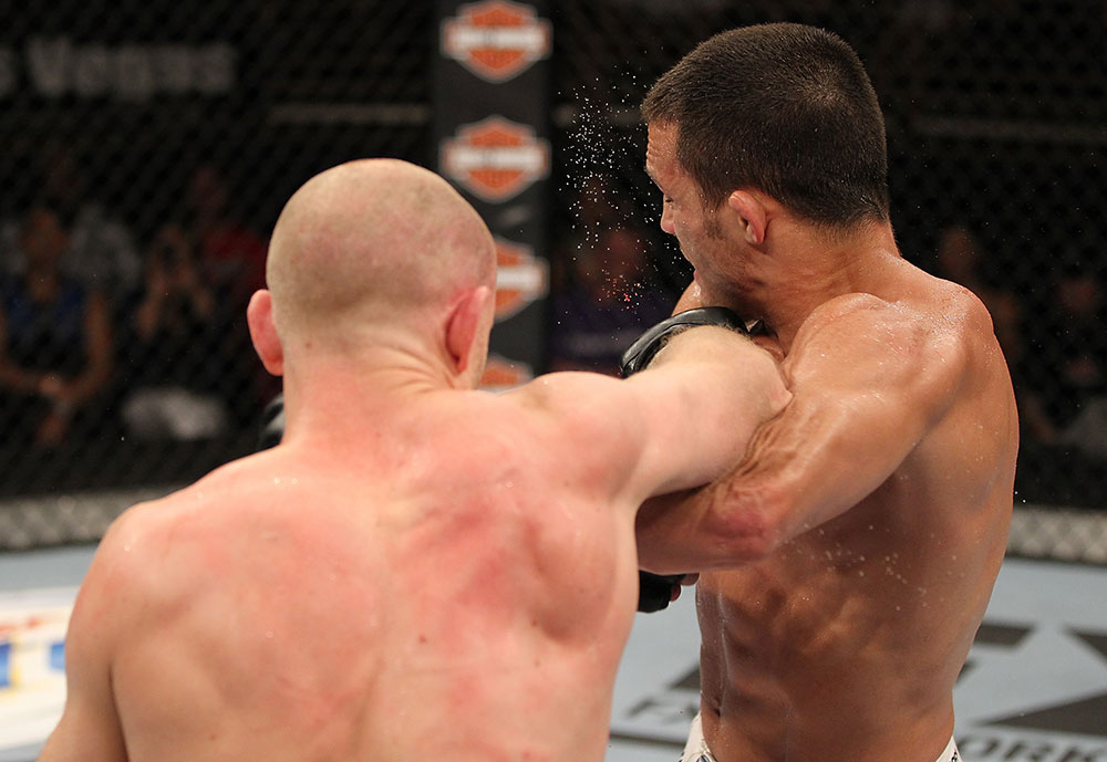 LAS VEGAS, NV - JUNE 01: (L-R) Martin Kampmann punches Jake Ellenberger in a Welterweight bout during The Ultimate Fighter Live Finale at the Pearl Theater at the Palms Casino Resort on June 1, 2012 in Las Vegas, Nevada. (Photo by Josh Hedges/Zuffa LLC/Zuffa LLC via Getty Images) *** Local Caption *** Jake Ellenberger; Martin Kampmann