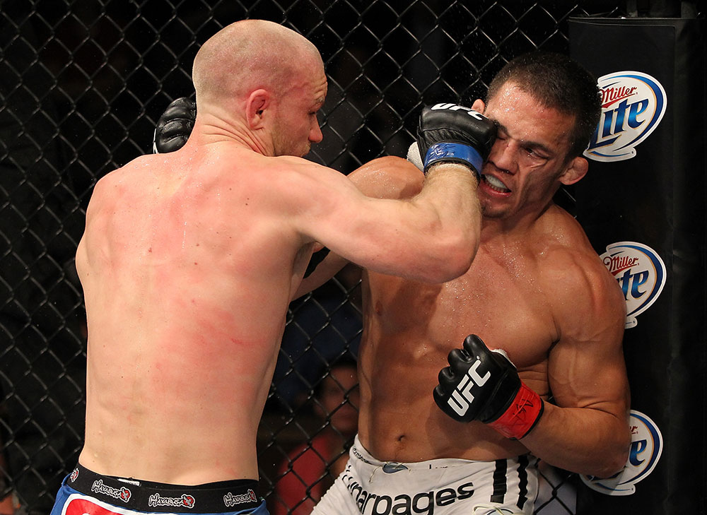 LAS VEGAS, NV - JUNE 01: Martin Kampmann (left) punches Jake Ellenberger in a Welterweight bout during The Ultimate Fighter Live Finale at the Pearl Theater at the Palms Casino Resort on June 1, 2012 in Las Vegas, Nevada. (Photo by Josh Hedges/Zuffa LLC/Zuffa LLC via Getty Images) *** Local Caption *** Jake Ellenberger; Martin Kampmann