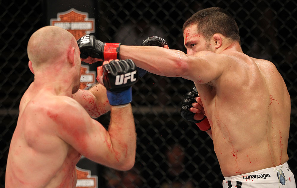 LAS VEGAS, NV - JUNE 01: (R-L) Jake Ellenberger punches Martin Kampmann in a Welterweight bout during The Ultimate Fighter Live Finale at the Pearl Theater at the Palms Casino Resort on June 1, 2012 in Las Vegas, Nevada. (Photo by Josh Hedges/Zuffa LLC/Zuffa LLC via Getty Images) *** Local Caption *** Jake Ellenberger; Martin Kampmann