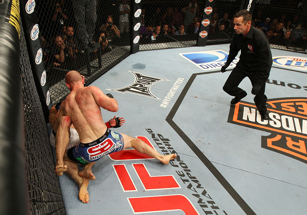 LAS VEGAS, NV - JUNE 01: Martin Kampmann (blue shorts) attempts to finish Jake Ellenberger as referee Steve Mazzagatti (right) observes in a Welterweight bout during The Ultimate Fighter Live Finale at the Pearl Theater at the Palms Casino Resort on June 1, 2012 in Las Vegas, Nevada. (Photo by Josh Hedges/Zuffa LLC/Zuffa LLC via Getty Images) *** Local Caption *** Jake Ellenberger; Martin Kampmann