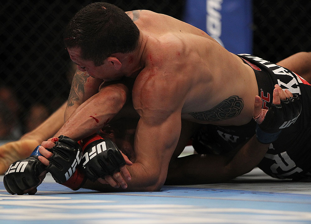LAS VEGAS, NV - JULY 7:   Rafaello Oliveira (top) attempts to submit Yoislandy Izquierdo during their lightweight bout at UFC 148 inside MGM Grand Garden Arena on July 7, 2012 in Las Vegas, Nevada.  (Photo by Josh Hedges/Zuffa LLC/Zuffa LLC via Getty Images)  *** Local Caption *** Yoislandy Izquierdo; Rafaello Oliveira