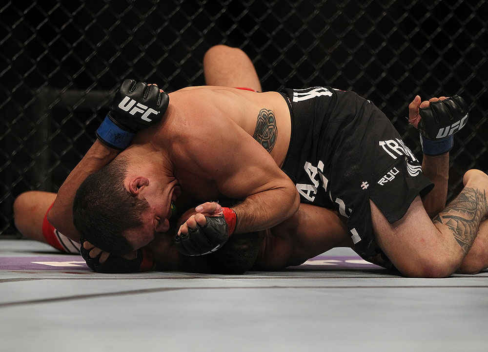 LAS VEGAS, NV - JULY 7:   Rafaello Oliveira (top) elbows Yoislandy Izquierdo during their lightweight bout at UFC 148 inside MGM Grand Garden Arena on July 7, 2012 in Las Vegas, Nevada.  (Photo by Josh Hedges/Zuffa LLC/Zuffa LLC via Getty Images)  *** Local Caption *** Yoislandy Izquierdo; Rafaello Oliveira