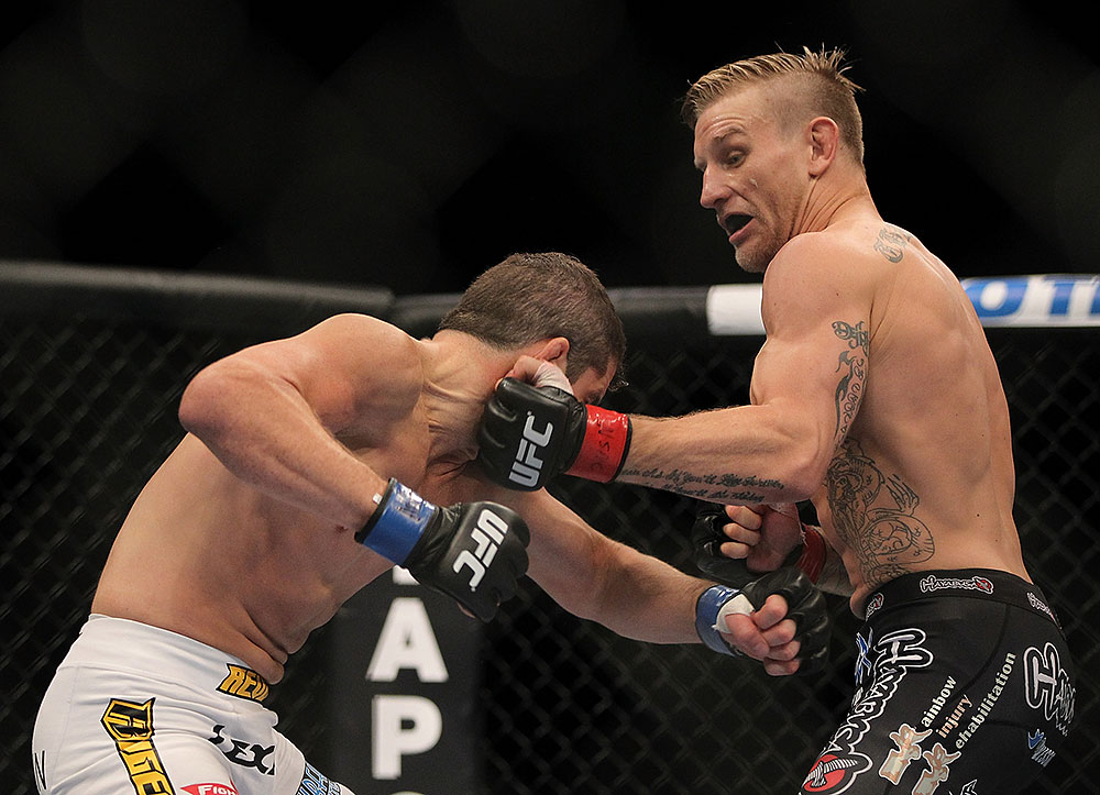 LAS VEGAS, NV - JULY 7:   (R-L) John Alessio punches Shane Roller during their lightweight bout at UFC 148 inside MGM Grand Garden Arena on July 7, 2012 in Las Vegas, Nevada.  (Photo by Josh Hedges/Zuffa LLC/Zuffa LLC via Getty Images)  *** Local Caption *** John Alessio; Shane Roller