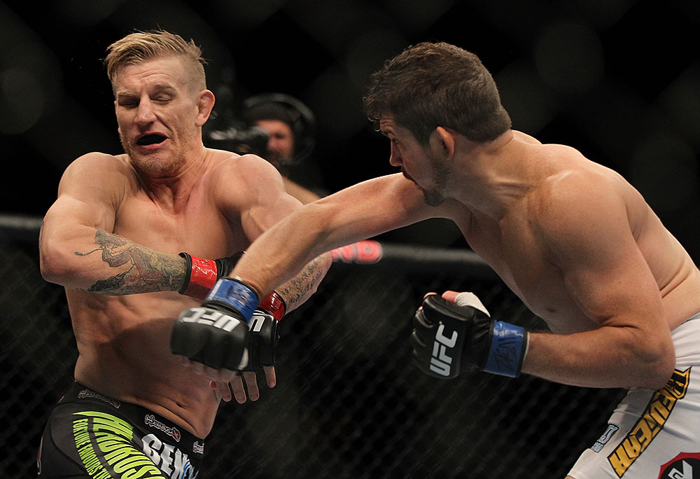 LAS VEGAS, NV - JULY 7:   (R-L) Shane Roller punches John Alessio during their lightweight bout at UFC 148 inside MGM Grand Garden Arena on July 7, 2012 in Las Vegas, Nevada.  (Photo by Josh Hedges/Zuffa LLC/Zuffa LLC via Getty Images)  *** Local Caption *** John Alessio; Shane Roller