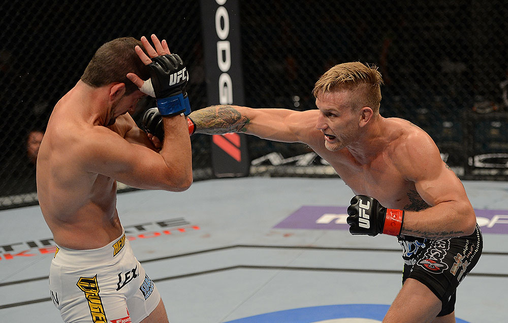 LAS VEGAS, NV - JULY 7:   (R-L) John Alessio punches Shane Roller during their lightweight bout at UFC 148 inside MGM Grand Garden Arena on July 7, 2012 in Las Vegas, Nevada.  (Photo by Donald Miralle/Zuffa LLC/Zuffa LLC via Getty Images)  *** Local Caption *** John Alessio; Shane Roller