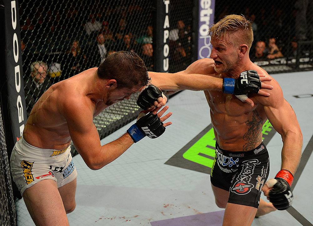 LAS VEGAS, NV - JULY 7:   (R-L) John Alessio punches Shane Roller during their lightweight bout at UFC 148 inside MGM Grand Garden Arena on July 7, 2012 in Las Vegas, Nevada.  (Photo by Donald Miralle/Zuffa LLC/Zuffa LLC via Getty Images)  *** Local Caption *** John Alessio; Shane Roller