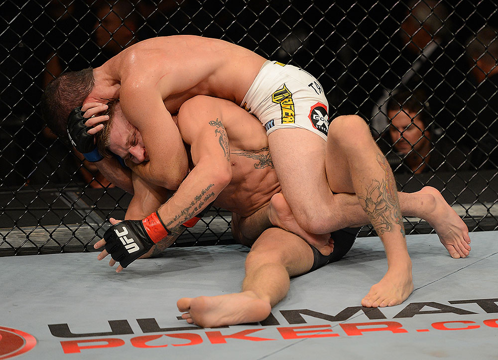 LAS VEGAS, NV - JULY 7:   Shane Roller (top) attempts to submit John Alessio during their lightweight bout at UFC 148 inside MGM Grand Garden Arena on July 7, 2012 in Las Vegas, Nevada.  (Photo by Donald Miralle/Zuffa LLC/Zuffa LLC via Getty Images)  *** Local Caption *** John Alessio; Shane Roller