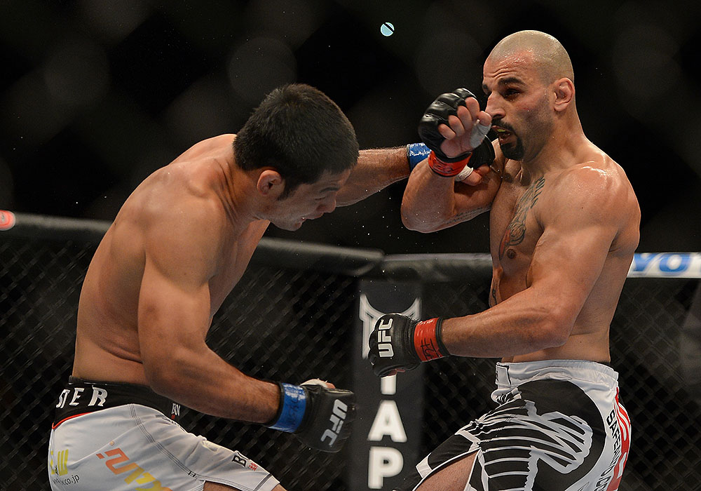 LAS VEGAS, NV - JULY 7:   (L-R) Riki Fukuda punches Costa Philippou during their middleweight bout at UFC 148 inside MGM Grand Garden Arena on July 7, 2012 in Las Vegas, Nevada.  (Photo by Donald Miralle/Zuffa LLC/Zuffa LLC via Getty Images)  *** Local Caption *** Constantinos Philippou; Riki Fukuda