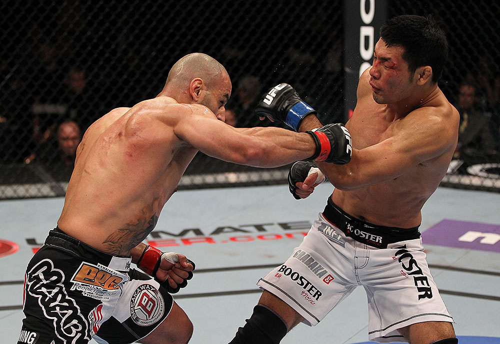 LAS VEGAS, NV - JULY 7:   (L-R) Costa Philippou punches Riki Fukuda during their middleweight bout at UFC 148 inside MGM Grand Garden Arena on July 7, 2012 in Las Vegas, Nevada.  (Photo by Josh Hedges/Zuffa LLC/Zuffa LLC via Getty Images)  *** Local Caption *** Constantinos Philippou; Riki Fukuda