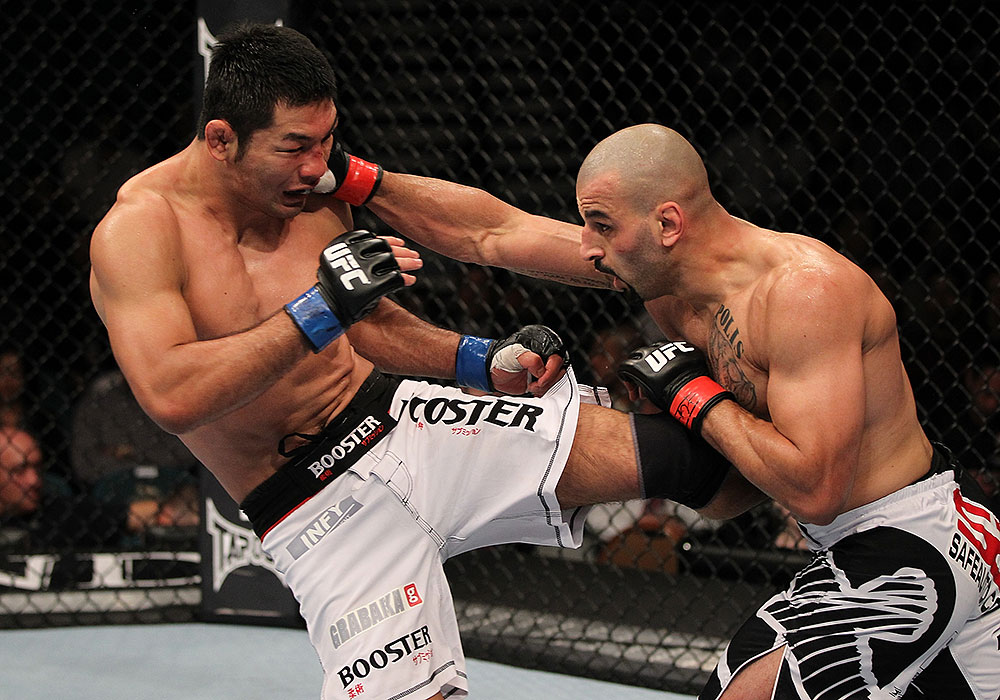 LAS VEGAS, NV - JULY 7:   (L-R) Riki Fukuda and Costa Philippou exchange strikes during their middleweight bout at UFC 148 inside MGM Grand Garden Arena on July 7, 2012 in Las Vegas, Nevada.  (Photo by Josh Hedges/Zuffa LLC/Zuffa LLC via Getty Images)  *** Local Caption *** Constantinos Philippou; Riki Fukuda