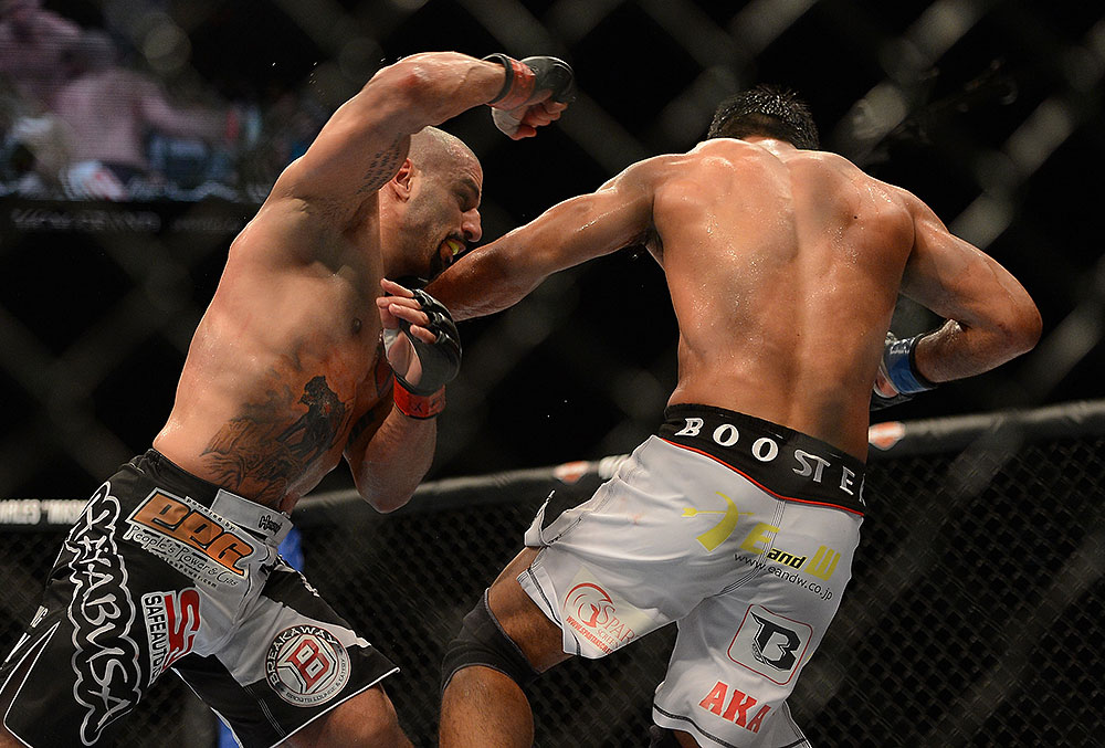 LAS VEGAS, NV - JULY 7:   (L-R) Costa Philippou punches Riki Fukuda during their middleweight bout at UFC 148 inside MGM Grand Garden Arena on July 7, 2012 in Las Vegas, Nevada.  (Photo by Donald Miralle/Zuffa LLC/Zuffa LLC via Getty Images)  *** Local Caption *** Constantinos Philippou; Riki Fukuda