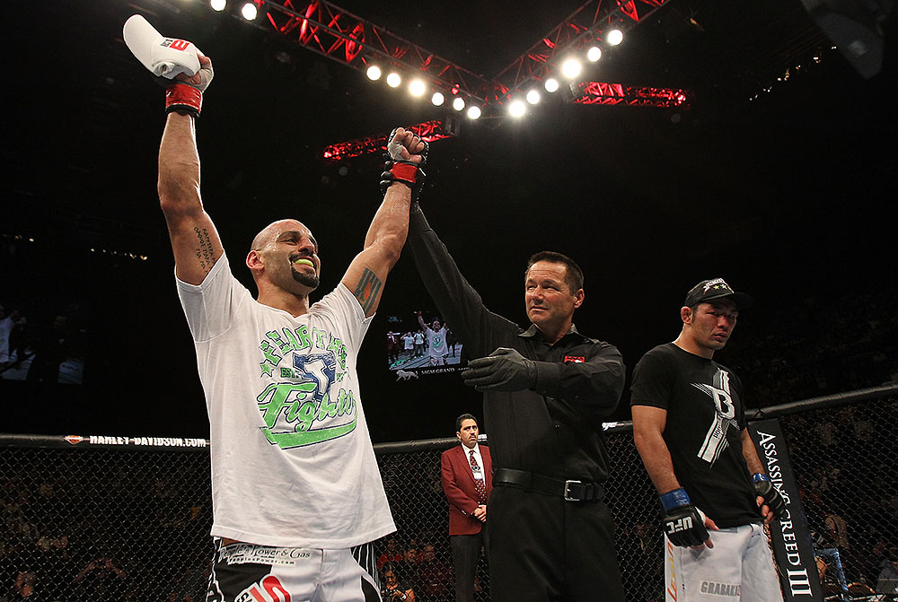 LAS VEGAS, NV - JULY 7:   Costa Philippou (left) reacts to being declared the winner in his fight against Riki Fukuda (right) after their middleweight bout at UFC 148 inside MGM Grand Garden Arena on July 7, 2012 in Las Vegas, Nevada.  (Photo by Josh Hedges/Zuffa LLC/Zuffa LLC via Getty Images)  *** Local Caption *** Constantinos Philippou; Riki Fukuda