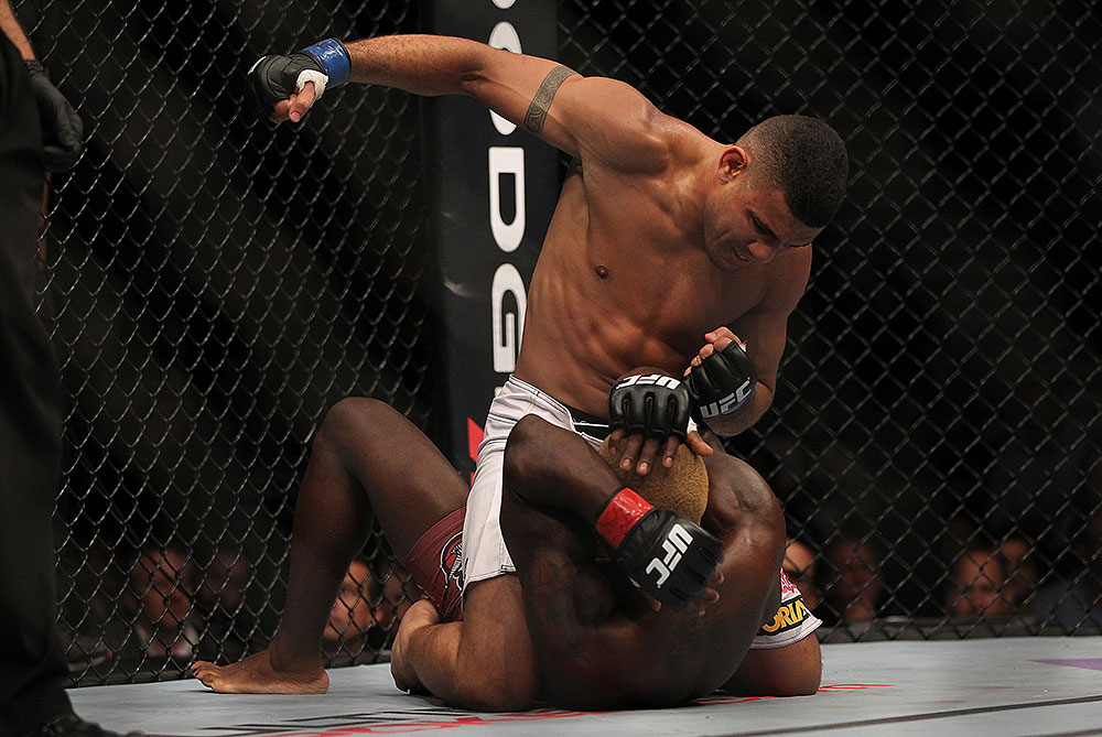 LAS VEGAS, NV - JULY 7:   Fabricio Camoes (top) punches Melvin Guillard during their lightweight bout at UFC 148 inside MGM Grand Garden Arena on July 7, 2012 in Las Vegas, Nevada.  (Photo by Josh Hedges/Zuffa LLC/Zuffa LLC via Getty Images)  *** Local Caption *** Melvin Guillard; Fabricio Camoes
