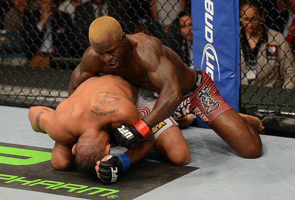 LAS VEGAS, NV - JULY 7:   Melvin Guillard (top) punches Fabricio Camoes during their lightweight bout at UFC 148 inside MGM Grand Garden Arena on July 7, 2012 in Las Vegas, Nevada.  (Photo by Donald Miralle/Zuffa LLC/Zuffa LLC via Getty Images)  *** Local Caption *** Melvin Guillard; Fabricio Camoes