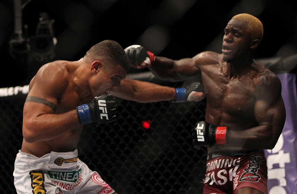 LAS VEGAS, NV - JULY 7:   Mevlin Guillard (right) punches Fabricio Camoes during their lightweight bout at UFC 148 inside MGM Grand Garden Arena on July 7, 2012 in Las Vegas, Nevada.  (Photo by Josh Hedges/Zuffa LLC/Zuffa LLC via Getty Images)  *** Local Caption *** Melvin Guillard; Fabricio Camoes