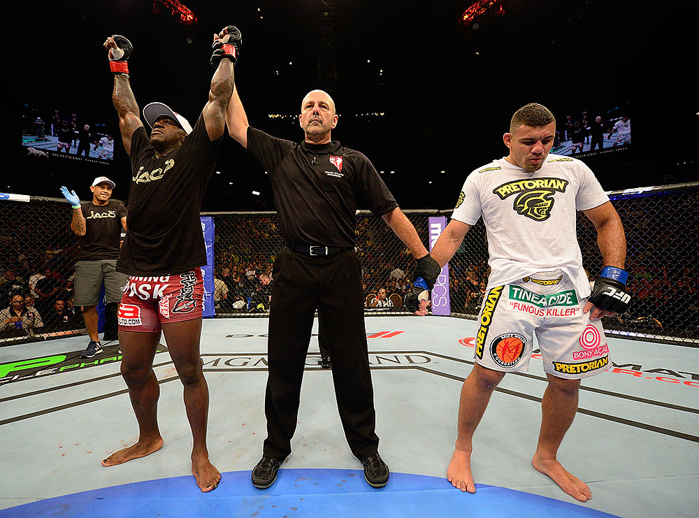 LAS VEGAS, NV - JULY 7:   Melvin Guillard (left) is declared the winner in his fight against Fabricio Camoes (right) during UFC 148 inside MGM Grand Garden Arena on July 7, 2012 in Las Vegas, Nevada.  (Photo by Donald Miralle/Zuffa LLC/Zuffa LLC via Getty Images)  *** Local Caption *** Melvin Guillard; Fabricio Camoes